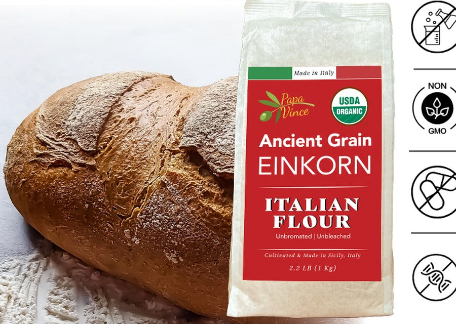 Papa Vince Ancient Grain Einkorn Italian Flour bag beside a fresh rustic loaf of einkorn bread, organic and stone-milled in Sicily