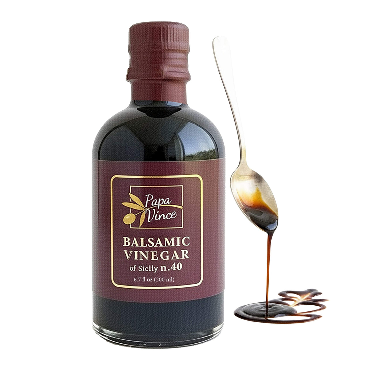 Papa Vince Balsamic Vinegar of Sicily 40 bottle with a spoon drizzle showing rich texture and deep color.
